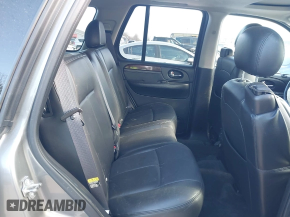 2005 GMC Envoy SLE with VIN 1GKDT13S852362380, listed as a IAAI auction lot 42031727 with 76,711 mi miles. Bid and sale history available at carsss.com. Image 8.
