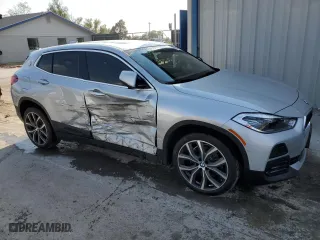 2021 BMW X2 xDrive28i with VIN WBXYJ1C07M5S52616, listed as a Copart auction lot 70234144 with 96,459 mi miles and Salvage Title. Bid and sale history available at carsss.com. Image 4.
