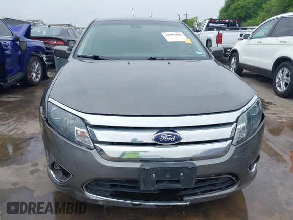 2012 Ford Fusion Hybrid z VIN 3FADP0L33CR289548, wystawiony jako IAAI lot #41905806 z przebiegiem 121 233 mil mil oraz . Historia ofert i sprzedaży dostępna na DreamBid. Obrazek 6.