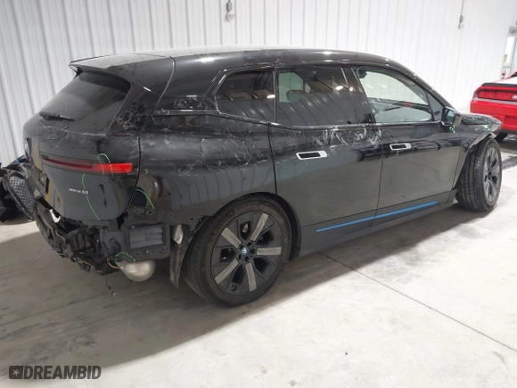 2023 BMW iX xDrive50 with VIN WB523CF04PCL15607, listed as a IAAI auction lot 41315457 with 44,058 mi miles. Bid and sale history available at carsss.com. Image 4.