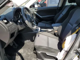 2014 Mazda CX-5 Sport with VIN JM3KE2BE7E0334880, listed as a Copart auction lot 61780635 with 96,926 mi miles and Salvage title. Bid and sale history available at DreamBid. Image 7.