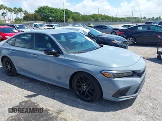 2023 Honda Civic Sport z VIN 2HGFE2F59PH530386, wystawiony jako IAAI lot #41947587 z przebiegiem 32 155 mil mil oraz . Historia ofert i sprzedaży dostępna na DreamBid. Obrazek 1.