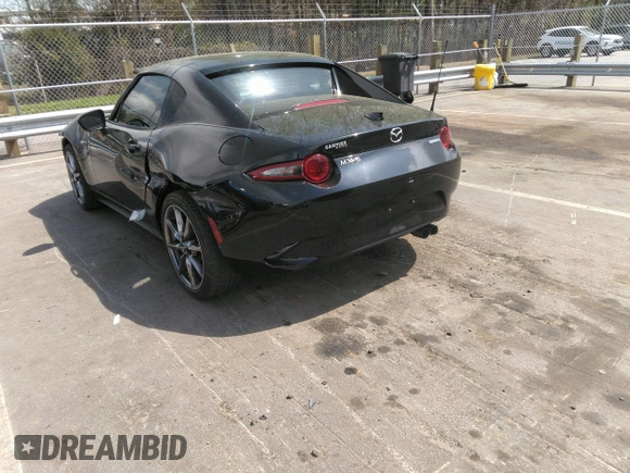 2021 Mazda MX-5 Miata Grand Touring z VIN JM1NDAM75M0451597, wystawiony jako IAAI lot #41932712 z przebiegiem 61 710 mil mil oraz . Historia ofert i sprzedaży dostępna na DreamBid. Obrazek 3.
