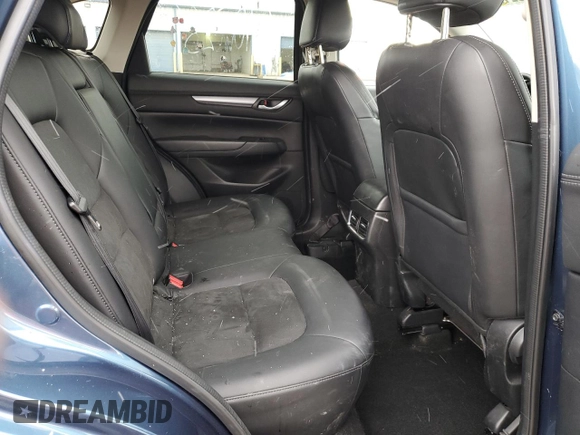 2017 Mazda CX-5 Touring z VIN JM3KFBCL2H0129000, wystawiony jako Copart lot #52107005 z przebiegiem 55 411 mil mil oraz Szkody całkowita. Historia ofert i sprzedaży dostępna na DreamBid. Obrazek 11.