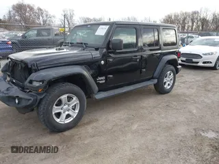 2018 Jeep Wrangler Unlimited Sport с VIN 1C4HJXDGXJW189576, выставлен на аукционе IAAI как лот 41906106 с пробегом 60 463 миль миль и . История ставок и продаж доступна на DreamBid. Изображение 2.