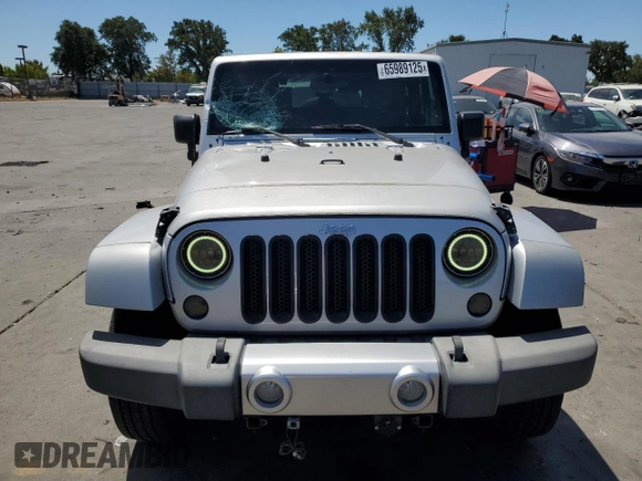 2009 Jeep Wrangler Sahara with VIN 1J4FA54149L708183, listed as a Copart auction lot 65989125 with 133,436 mi miles and Salvage title. Bid and sale history available at DreamBid. Image 5.