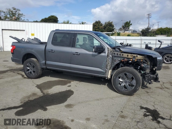 2023 Ford F-150 Lightning Pro with VIN 1FT6W1EV0PWG34788, listed as a Copart auction lot 54454805 with 11,432 mi miles and Salvage title. Bid and sale history available at DreamBid. Image 4.