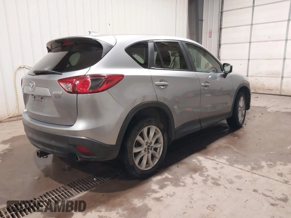 2015 Mazda CX-5 Grand Touring with VIN JM3KE4DY2F0477966, listed as a IAAI auction lot 41247178 with 116,582 mi miles. Bid and sale history available at carsss.com. Image 4.