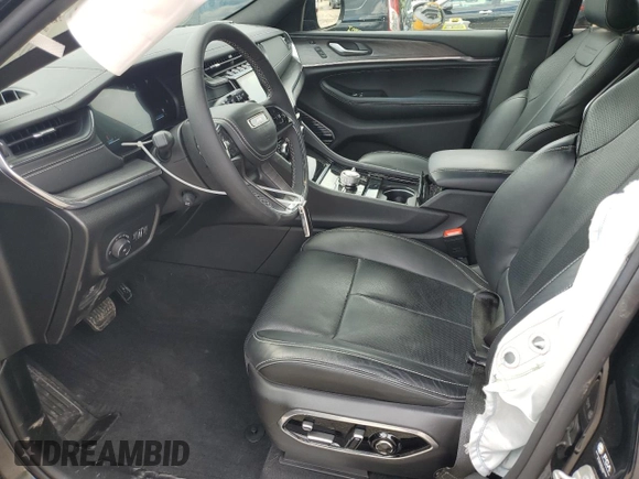 2023 Jeep Grand Cherokee Overland with VIN 1C4RJHDG0PC670537, listed as a Copart auction lot 56757285 with 24,735 mi miles and Salvage title. Bid and sale history available at DreamBid. Image 7.