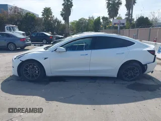 2018 Tesla Model 3 Long Range Battery with VIN 5YJ3E1EB7JF108519, listed as a IAAI auction lot 41835266 with 120,662 mi miles and . Bid and sale history available at DreamBid. Image 14.