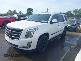 2020 Cadillac Escalade Luxury z VIN 1GYS3BKJ3LR144735, wystawiony jako IAAI lot #42161511 z przebiegiem 77 990 mil mil oraz . Historia ofert i sprzedaży dostępna na DreamBid. Obrazek 2.