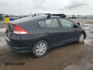 2010 Honda Insight LX with VIN JHMZE2H59AS022362, listed as a Copart auction lot 59442435 with 161,009 mi miles and Salvage title. Bid and sale history available at DreamBid. Image 3.