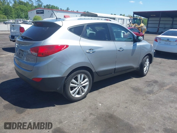 2013 Hyundai Tucson GLS with VIN KM8JU3AC4DU588062, listed as a IAAI auction lot 42080348 with 76,937 mi miles. Bid and sale history available at carsss.com. Image 4.