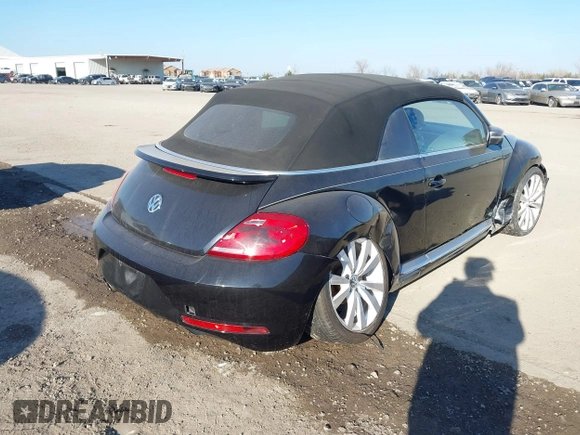 2014 Volkswagen Beetle 1.8T with VIN 3VW517AT4EM815243, listed as a IAAI auction lot 41245346 with 119,259 mi miles and . Bid and sale history available at DreamBid. Image 4.