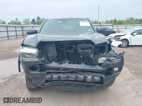 2018 Toyota Tacoma SR5 with VIN 5TFAZ5CN5JX062498, listed as a IAAI auction lot 41867393 with 128,879 mi miles and . Bid and sale history available at DreamBid. Image 6.