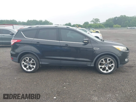 2015 Ford Escape Titanium z VIN 1FMCU0JX7FUB00462, wystawiony jako IAAI lot #42532943 z przebiegiem 88 623 mil mil oraz . Historia ofert i sprzedaży dostępna na DreamBid. Obrazek 13.