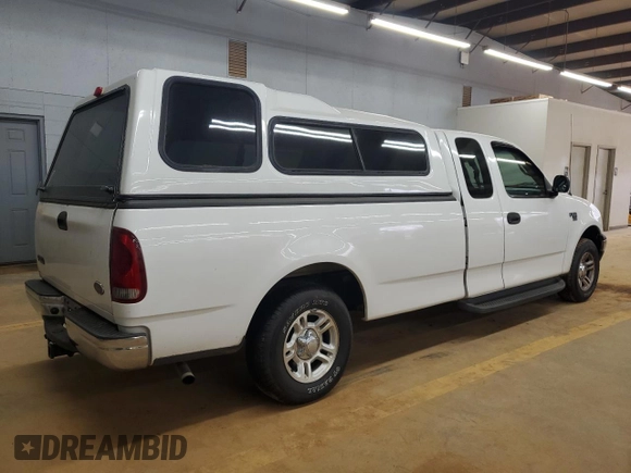 2001 Ford F-150 XL with VIN 1FTRX17L51NB25752, listed as a Copart auction lot 48721235 with 179,941 mi miles and Salvage title. Bid and sale history available at DreamBid. Image 3.