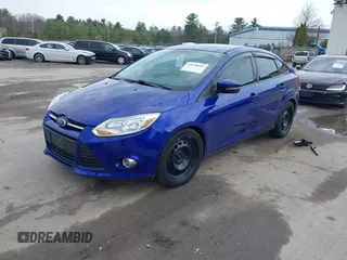 2014 Ford Focus SE with VIN 1FADP3F21EL314534, listed as a IAAI auction lot 42130032 with 103,866 mi miles. Bid and sale history available at carsss.com. Image 2.