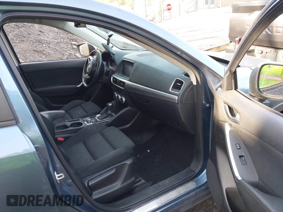 2016 Mazda CX-5 Touring with VIN JM3KE4CY5G0771252, listed as a IAAI auction lot 42138637 with 106,767 mi miles and . Bid and sale history available at carsss.com. Image 5.