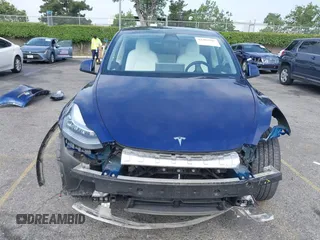 2023 Tesla Model Y Long Range z VIN 7SAYGDEE5PA102285, wystawiony jako IAAI lot #42402981 z przebiegiem 24 550 mil mil oraz . Historia ofert i sprzedaży dostępna na DreamBid. Obrazek 13.