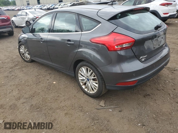 2017 Ford Focus Titanium z VIN 1FADP3N29HL240527, wystawiony jako Copart lot #62891695 z przebiegiem 126 926 mil mil oraz Szkoda całkowita • Salvage title. Historia ofert i sprzedaży dostępna na DreamBid. Obrazek 2.