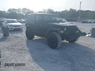 2020 Jeep Wrangler Sport S with VIN 1C4GJXAN1LW146701, listed as a IAAI auction lot 42313354 with 49,806 mi miles and . Bid and sale history available at DreamBid. Image 1.