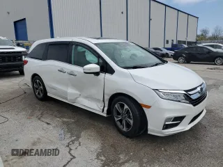 2020 Honda Odyssey Touring with VIN 5FNRL6H8XLB019365, listed as a Copart auction lot 52404335 with 59,486 mi miles and Salvage Title. Bid and sale history available at DreamBid. Image 4.