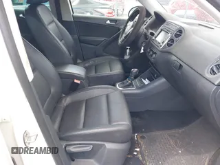 2012 Volkswagen Tiguan S with VIN WVGAV7AX0CW566151, listed as a IAAI auction lot 42826985 with 121,185 mi miles and . Bid and sale history available at DreamBid. Image 5.