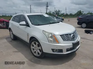 2014 Cadillac SRX Premium Collection z VIN 3GYFNDE31ES615995, wystawiony jako IAAI lot #42148943 z przebiegiem 232 752 mil mil oraz . Historia ofert i sprzedaży dostępna na DreamBid. Obrazek 1.