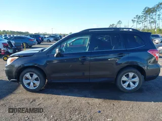 2014 Subaru Forester 2.5i Touring with VIN JF2SJAMC1EH452856, listed as a IAAI auction lot 41801406 with 148,342 mi miles. Bid and sale history available at carsss.com. Image 14.