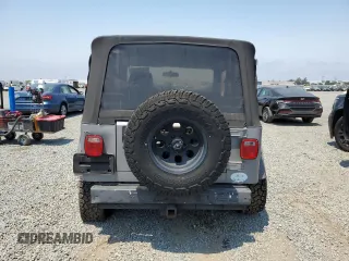2001 Jeep Wrangler Sport с VIN 1J4FA49S41P353878, выставлен на аукционе Copart как лот 64637385 с пробегом 166 642 миль миль и Списание • Salvage title. История ставок и продаж доступна на DreamBid. Изображение 6.
