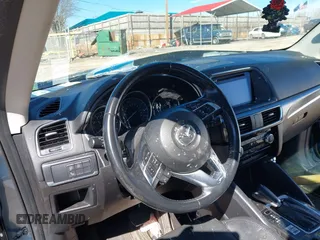 2016 Mazda CX-5 Grand Touring with VIN JM3KE2DY2G0715272, listed as a IAAI auction lot 41590492 with 134,176 mi miles. Bid and sale history available at carsss.com. Image 18.