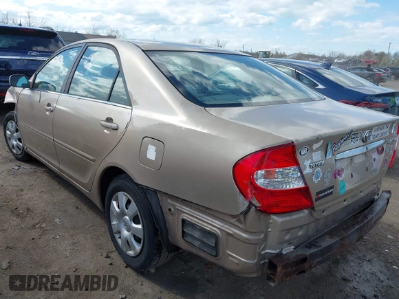 2003 Toyota Camry LE with VIN 4T1BE32KX3U123873, listed as a IAAI auction lot 42085492 with 166,901 mi miles and . Bid and sale history available at DreamBid. Image 3.
