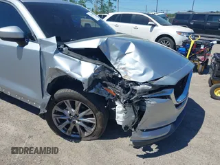 2019 Mazda CX-5 Grand Touring with VIN JM3KFADM1K1606082, listed as a IAAI auction lot 41875878 with 66,089 mi miles. Bid and sale history available at carsss.com. Image 6.