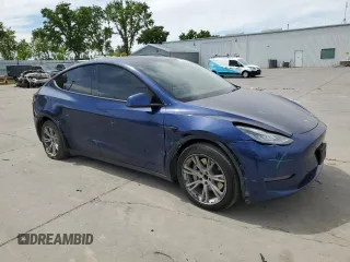 2021 Tesla Model Y Long Range with VIN 5YJYGDEE3MF094165, listed as a Copart auction lot 52907835 with 141,260 mi miles and Salvage Title. Bid and sale history available at DreamBid. Image 4.