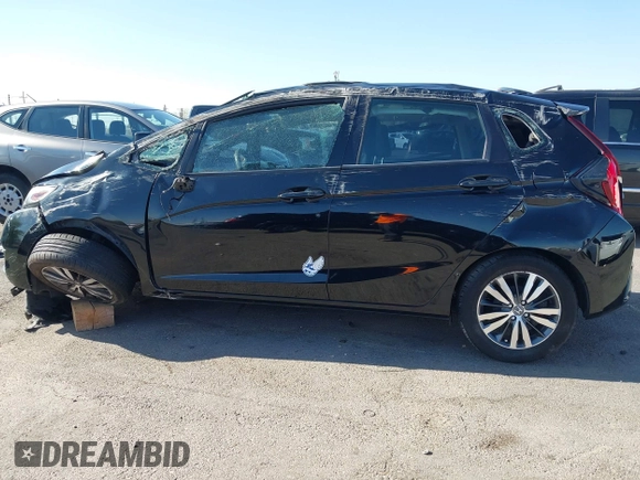 2015 Honda Fit EX-L z VIN 3HGGK5H81FM705199, wystawiony jako IAAI lot #42310099 z przebiegiem Nie podano mil oraz . Historia ofert i sprzedaży dostępna na DreamBid. Obrazek 14.