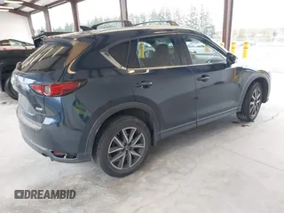 2018 Mazda CX-5 Grand Touring with VIN JM3KFBDM4J0302870, listed as a IAAI auction lot 41934217 with 57,151 mi miles. Bid and sale history available at carsss.com. Image 4.