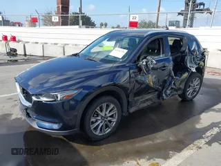 2021 Mazda CX-5 Grand Touring with VIN JM3KFBDM6M1312573, listed as a IAAI auction lot 41936739 with Not Provided miles and . Bid and sale history available at DreamBid. Image 17.