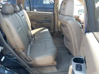 2005 Honda Pilot EX-L with VIN 5FNYF18555B043104, listed as a IAAI auction lot 41888235 with 127,781 mi miles. Bid and sale history available at carsss.com. Image 8.