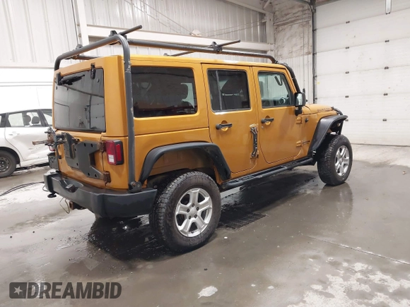 2014 Jeep Wrangler Unlimited Rubicon with VIN 1C4BJWFG7EL254534, listed as a IAAI auction lot 41279731 with 140,218 mi miles. Bid and sale history available at carsss.com. Image 4.