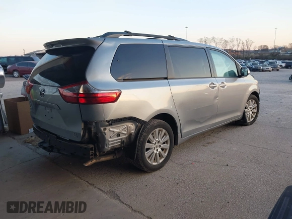 2016 Toyota Sienna LE with VIN 5TDJK3DC4GS133694, listed as a IAAI auction lot 41171171 with 99,680 mi miles. Bid and sale history available at carsss.com. Image 4.