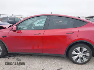2023 Tesla Model Y Long Range with VIN 7SAYGDEE6PA027497, listed as a IAAI auction lot 41491072 with 24,962 mi miles and . Bid and sale history available at DreamBid. Image 14.