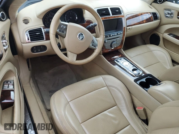 2011 Jaguar XK with VIN SAJWA4GB0BLB38875, listed as a Copart auction lot 52045805 with 35,487 mi miles and Salvage Title. Bid and sale history available at carsss.com. Image 8.
