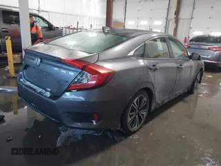2018 Honda Civic EX-T with VIN JHMFC1F35JX031132, listed as a IAAI auction lot 41591028 with 111,087 mi miles and . Bid and sale history available at DreamBid. Image 4.