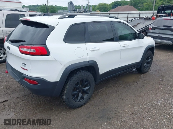 2016 Jeep Cherokee Trailhawk with VIN 1C4PJMBS6GW210756, listed as a IAAI auction lot 42423757 with Not provided miles and . Bid and sale history available at DreamBid. Image 4.