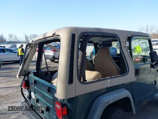 2001 Jeep Wrangler Sport with VIN 1J4FA49S31P317597, listed as a IAAI auction lot 41839524 with 145,164 mi miles. Bid and sale history available at carsss.com. Image 12.
