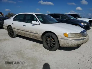 1998 Lincoln Continental with VIN 1LNFM97V5WY637895, listed as a Copart auction lot 77020154 with 0 mi miles and Salvage Title. Bid and sale history available at carsss.com. Image 4.