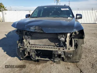 2023 Chevrolet Suburban LT with VIN 1GNSCCKD1PR124986, listed as a Copart auction lot 87432904 with 105,026 mi miles and Salvage Title. Bid and sale history available at DreamBid. Image 5.