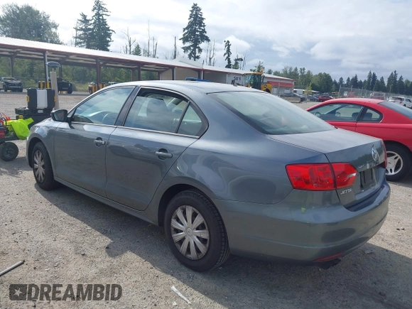 2013 Volkswagen Jetta S z VIN 3VW1K7AJ5DM242345, wystawiony jako IAAI lot #42598698 z przebiegiem 169 870 mil mil oraz . Historia ofert i sprzedaży dostępna na DreamBid. Obrazek 3.