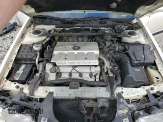 1995 Cadillac Seville Luxury SLS z VIN 1G6KS52Y7SU838169, wystawiony jako Copart lot #67941934 z przebiegiem 144 953 mil mil oraz Szkoda całkowita • Salvage title. Historia ofert i sprzedaży dostępna na DreamBid. Obrazek 11.